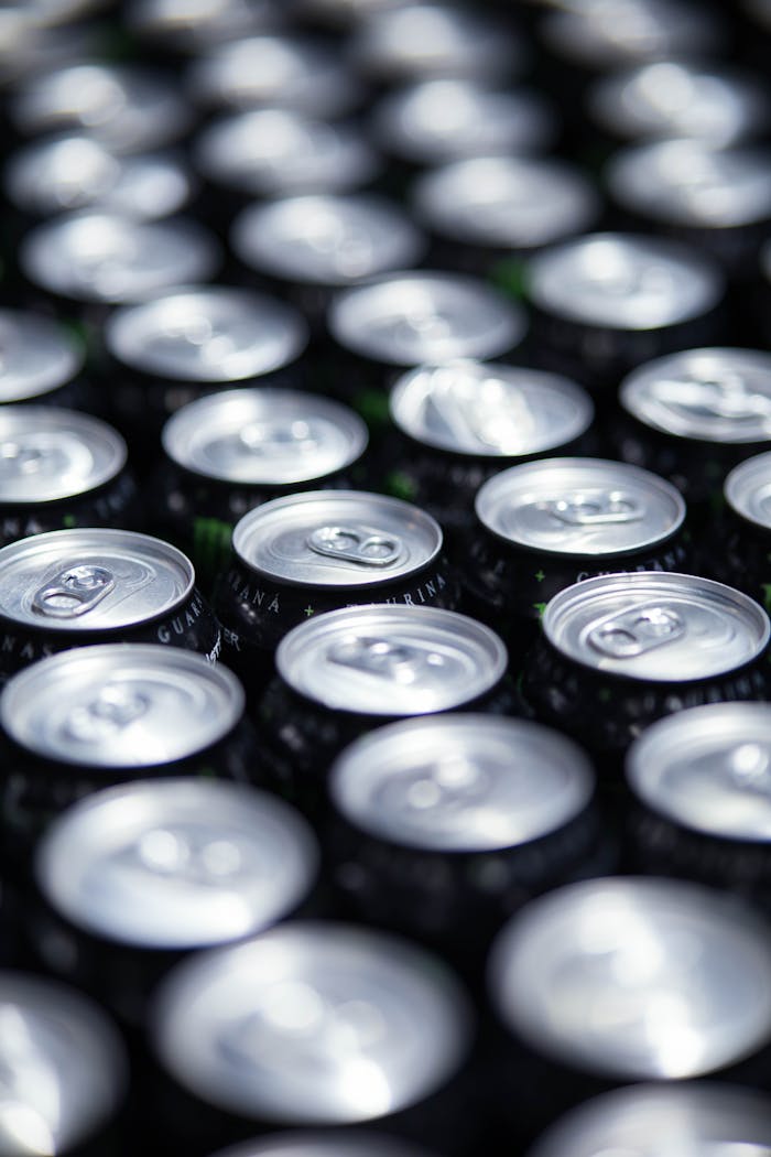 The Art of Drawing Readers In: Your attractive post title goes here High angle view of neatly arranged beverage cans, showcasing abundance.