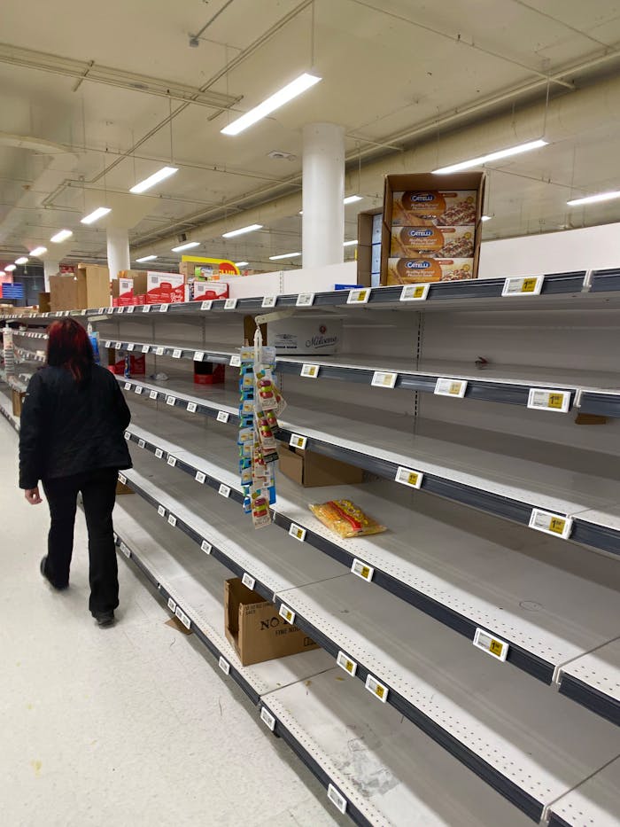 Mastering the First Impression: Your intriguing post title goes here A shopper walks past nearly empty supermarket shelves during a stock shortage.